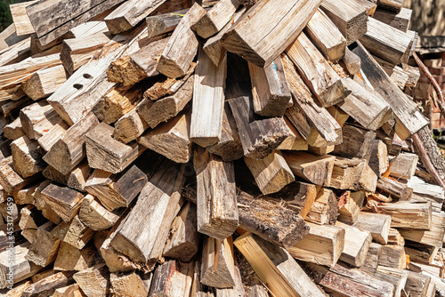 A pile of chopped fire wood, bacground.