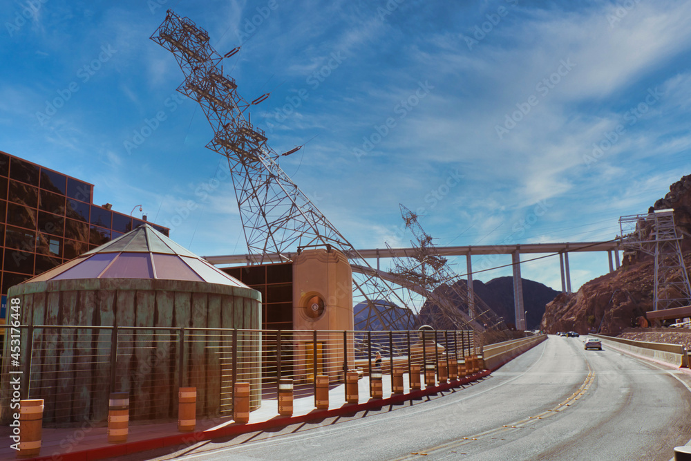 Electric tower in a crooked angle at Hoover Dam station, Nevada, USA Electric tower in a crooked angle at Hoover Dam station, Nevada, USA