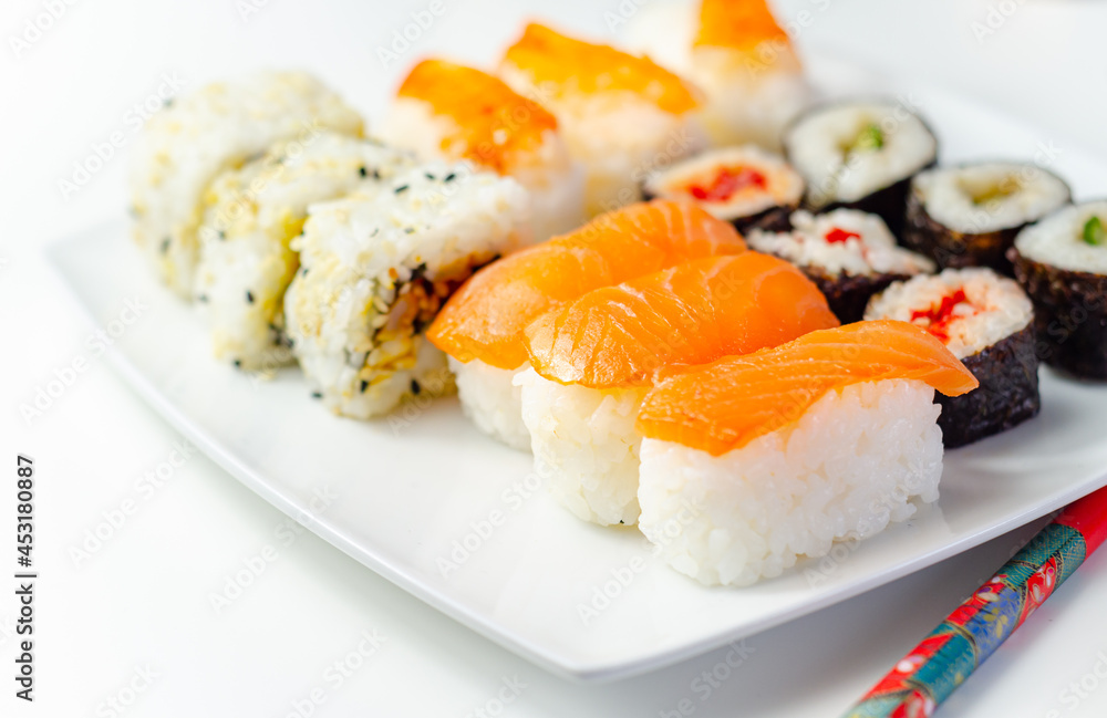 Set of smoked salmon nigiri, Ebi king prawn nigiri, katsu chicken and red pepper California roll, cucumber with wasabi hosomaki roll and red pepper hosomaki roll Set of smoked salmon nigiri, Ebi king prawn nigiri, katsu chicken and red pepper California roll, cucumber with wasabi hosomaki roll and red pepper hosomaki roll