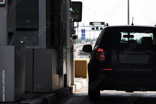 Driver pays for the fare on toll station highway. Highway toll station, collecting booth