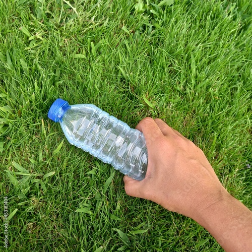 hand holding water bottle