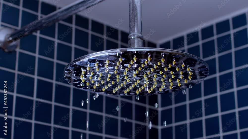 Shower flowing in close-up and slow motion. Shower flowing in close-up and slow motion.