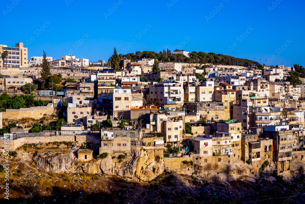 Jerusalem, Israel. view on Silwan or Siloam is arab neighborhood in East Jerusalem, on outskirts of Old City of Jerusalem. Part it builted atop necropolis cemetery of ancient Judea