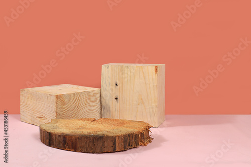 Fototapeta Naklejka Na Ścianę i Meble -  Abstract background with natural wood podiums, empty showcase for showcase or presentation of cosmetic products, scene with geometric shapes with place for text, minimal ecological concept