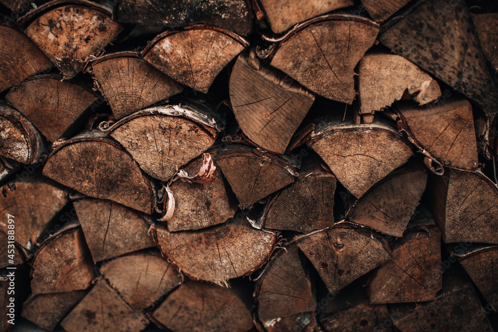 Close-up detail of chopped logs of a tree tied with a rope. Background with natural texture. Wooden. Rustic. Close-up detail of chopped logs of a tree tied with a rope. Background with natural texture. Wooden. Rustic.