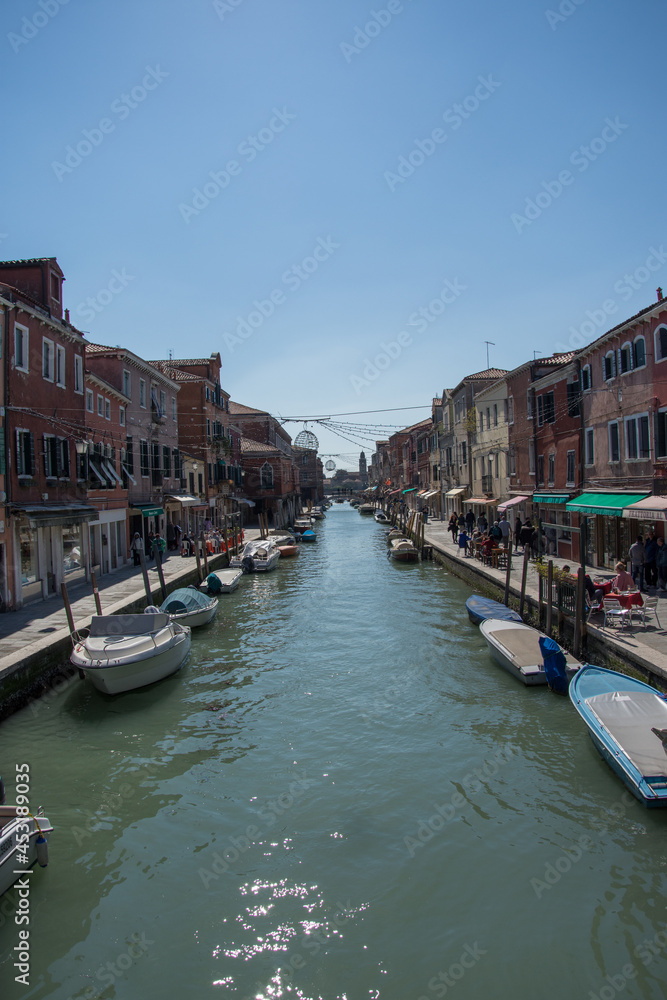 The vessel is on the canal in Murano, ,Architecture of buildings in Murano Island, Venice, Italy, 2019
