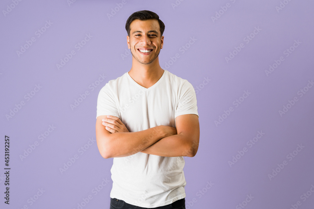 Cheerful man with his arm crossed Cheerful man with his arm crossed
