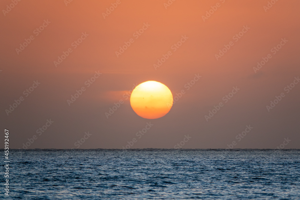Stunning view of a sunset in the middle of the ocean