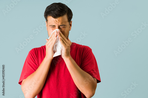 Hispanic man getting down with the flu