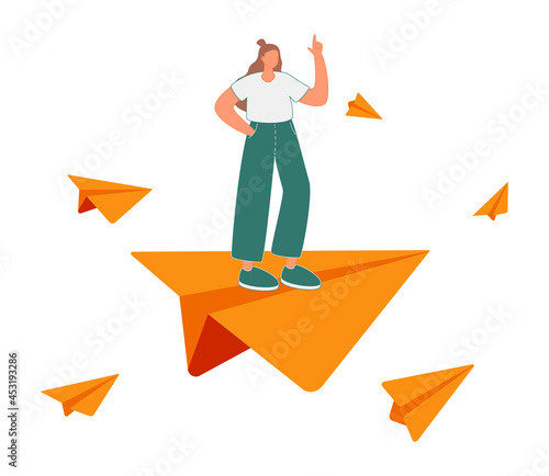 Business leadership, woman power to lead company to achieve target, smart confidence businesswoman standing on leading flying paper airplane origami pointing finger to the direction to reach goal.