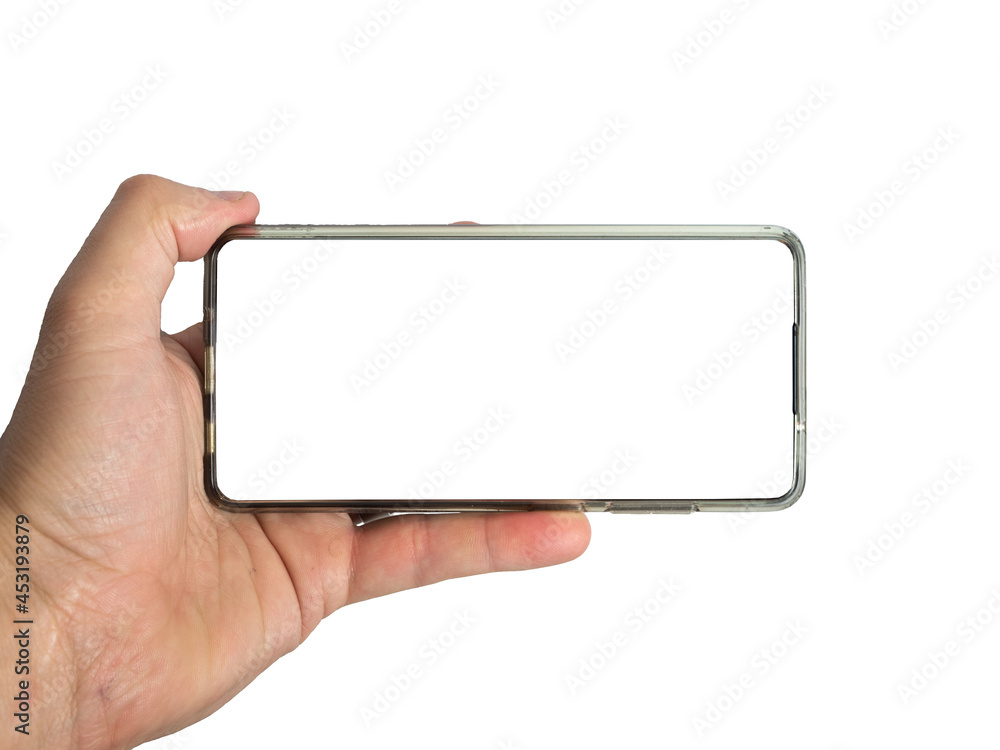 Male hand holding a blank smart phone isolated on white background with clipping path for the screen in widescreen format Male hand holding a blank smart phone isolated on white background with clipping path for the screen in widescreen format