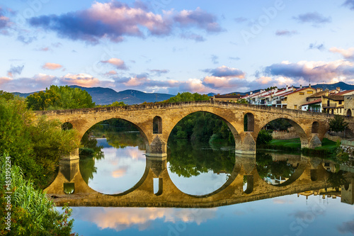 The Early Blue Hour on a Cloudy Evening over the Iconic Bridge in Puente la Reina, along the French Way of St James Camino de Santiago Pilgrim Trail