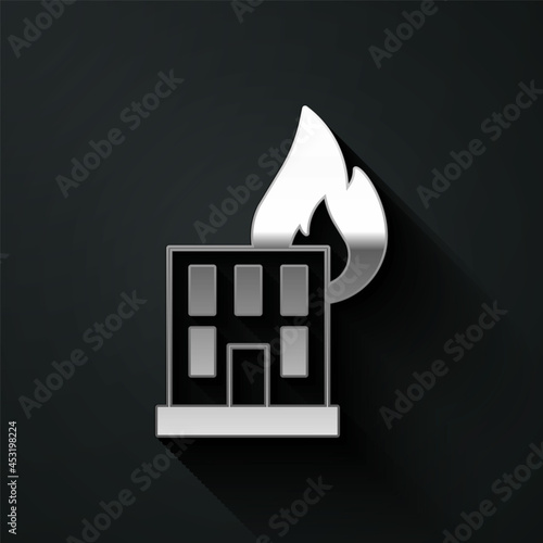 Silver Fire in burning building on city street icon isolated on black background. Destroyed city on fire. Long shadow style. Vector