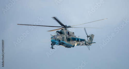 Fototapeta Naklejka Na Ścianę i Meble -  Military helicopter on a mission on a background of the sky.