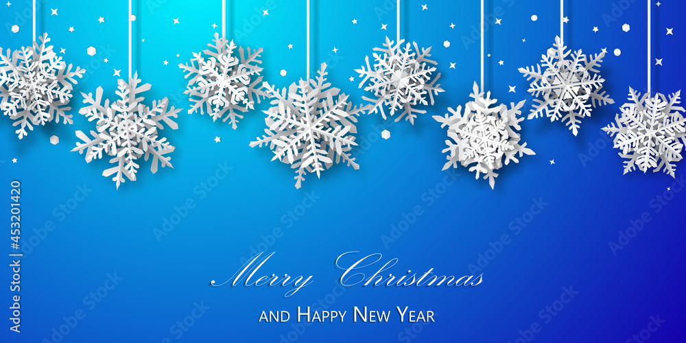 Christmas background of paper snowflakes with soft shadows, white on blue background Christmas background of paper snowflakes with soft shadows, white on blue background