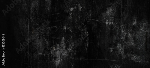 Dark scary grunge background with scratches, slightly light black concrete cement texture for background