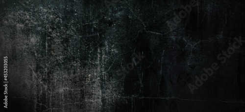 Dark scary grunge background with scratches, slightly light black concrete cement texture for background © Ronny sefria
