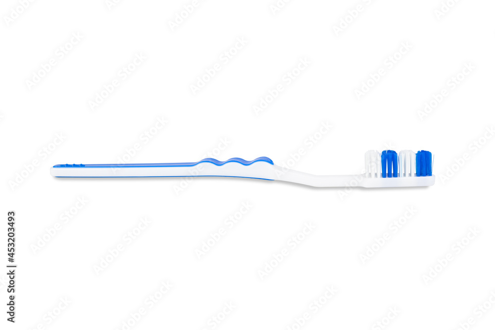 White-blue plastic toothbrush isolated on white background White-blue plastic toothbrush isolated on white background
