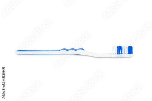 White-blue plastic toothbrush isolated on white background