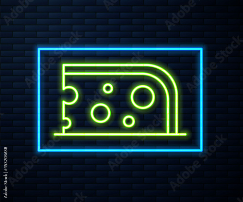 Glowing neon line Cheese icon isolated on brick wall background. Vector