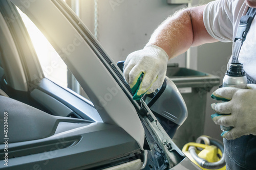 Process of preparing car for replacing windshield in car service. photo