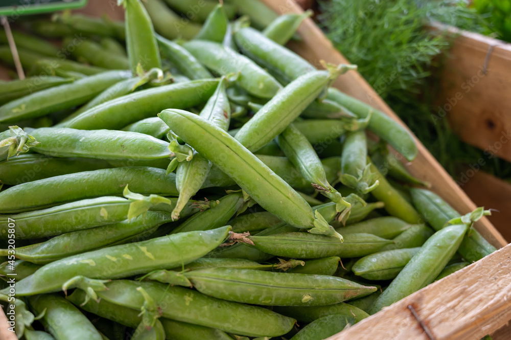 New harvest of green garden snap peas on weekly market in Provence, France New harvest of green garden snap peas on weekly market in Provence, France