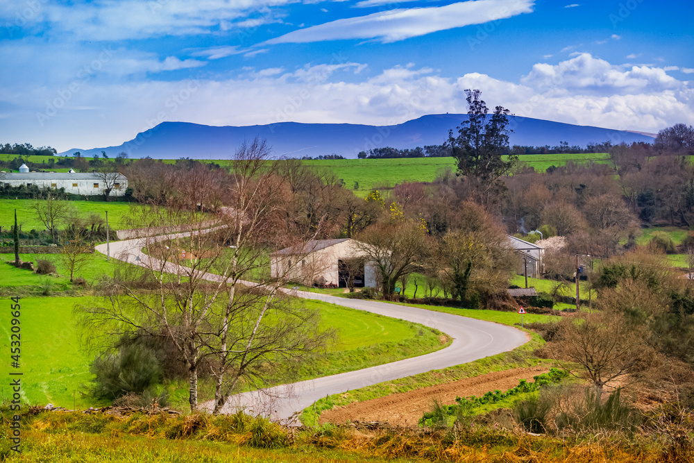 Winding Countryside Road in Beautiful Galicia Spain Landscape along the Way of St James Pilgrimage Trail Camino de Santiago