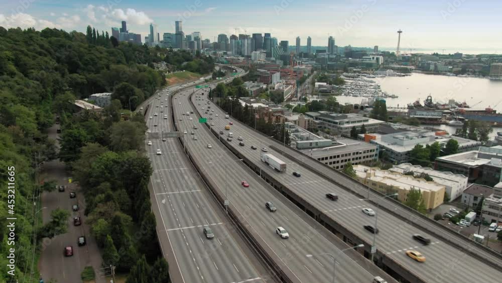 Aerial: freeway traffic on the Interstate 5 in Capitol Hill and city skyline, Seattle, USA Aerial: freeway traffic on the Interstate 5 in Capitol Hill and city skyline, Seattle, USA