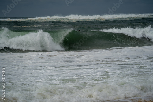 big barreling waves breaking on the beach