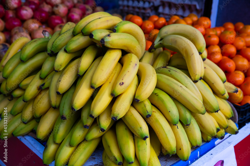 Fresh bananas on counter in food market