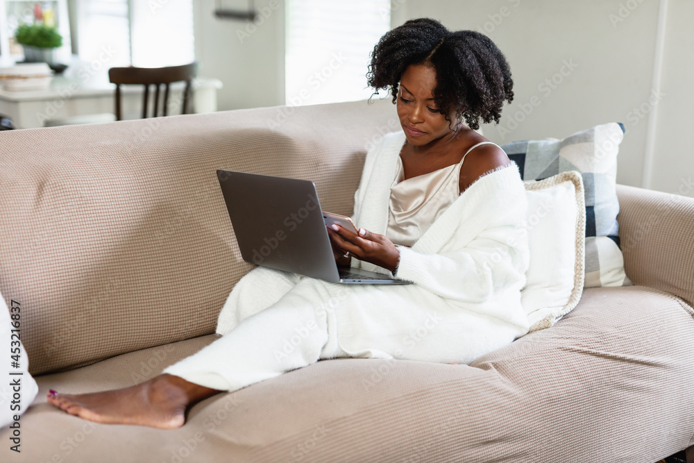 Black woman cozy, working from home Black woman cozy, working from home
