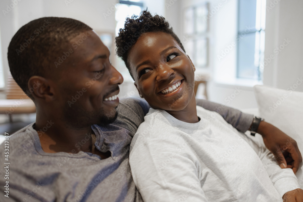Black Couple smiling and embracing Black Couple smiling and embracing