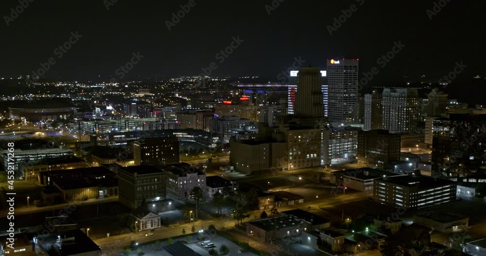 Memphis Tennessee Aerial v1 circular pan shot of cityscape with led heart shape display on first horizon bank and light illuminated bridge and pyramid in distance - Inspire 2, X7 camera - August 2020 Memphis Tennessee Aerial v1 circular pan shot of cityscape with led heart shape display on first horizon bank and light illuminated bridge and pyramid in distance - Inspire 2, X7 camera - August 2020