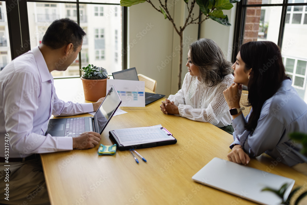Multiethnic group discussion on business operations Multiethnic group discussion on business operations
