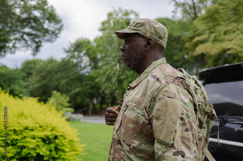 Black military man arrives home from service, active duty photo