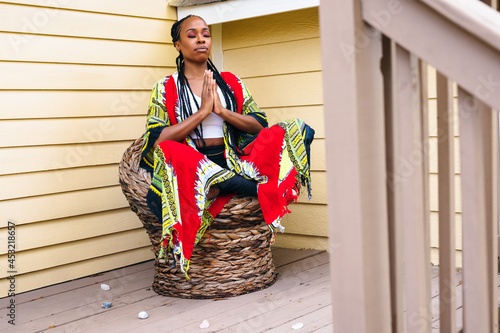 Black woman has peaceful meditation, crystals  photo