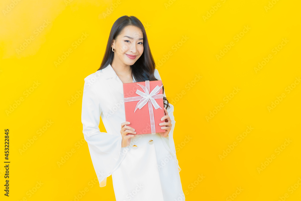 Portrait beautiful young asian woman smile with red gift box Portrait beautiful young asian woman smile with red gift box