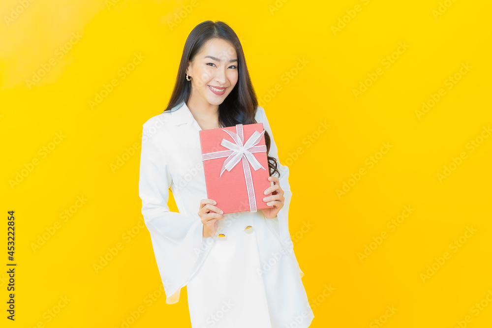 Portrait beautiful young asian woman smile with red gift box Portrait beautiful young asian woman smile with red gift box