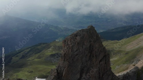 Flying towards mountain top with a Gipfelkreuz or summit cross on top photo