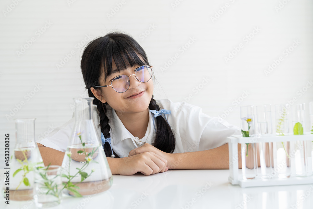 Asian girl scientists learning and doing analysis for germs with glassware in the laboratory. Scientific experiment. Early development of children. Research and development concept Asian girl scientists learning and doing analysis for germs with glassware in the laboratory. Scientific experiment. Early development of children. Research and development concept