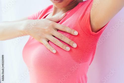 Wallpaper Mural An Asian woman with profuse sweating. A condition in which the body sweats abnormally through the skin. Torontodigital.ca