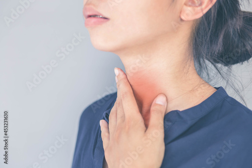 Women suffering from acid reflux. a burning sensation in the throat There is sputum inside. Chest tightness. Health care concept. photo