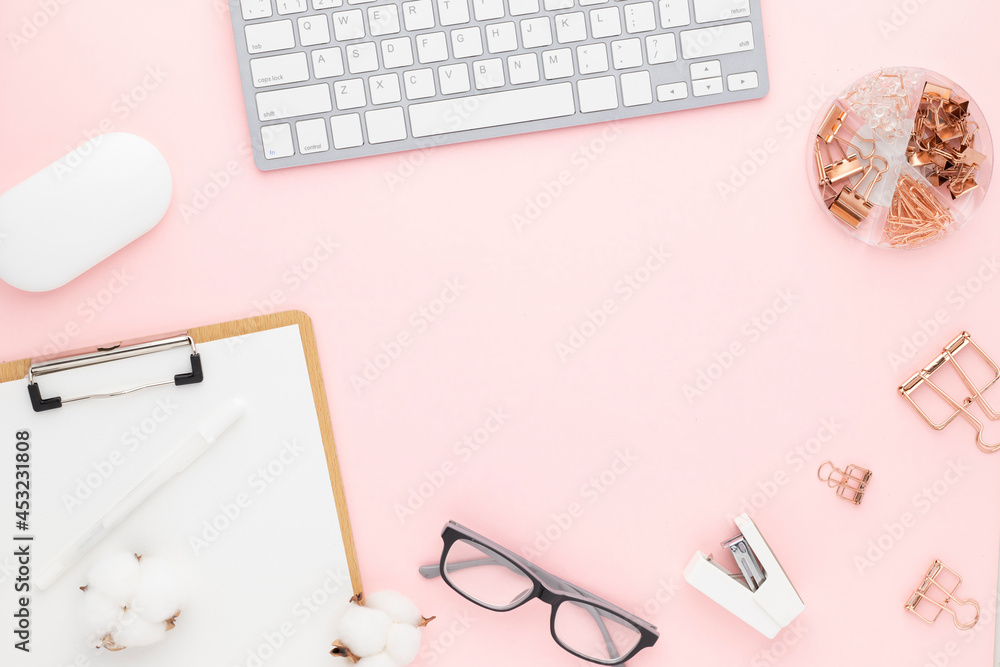 Office desk table top view with office supply, pink table with copy space, pink color workplace composition, flat lay Office desk table top view with office supply, pink table with copy space, pink color workplace composition, flat lay