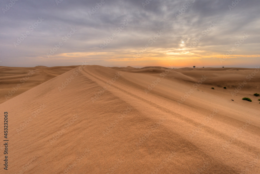 Sunset on a cloudy evening in Abu Dhabi desert
