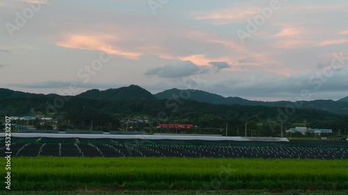 Sunset Clouds Over Geumsan Farm. View Of Geumsan Farm With Growing Rice Crops And Ginseng In South Korea - Time Lapse photo