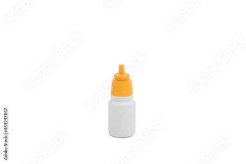 Medical equipment and eye drop isolated on white background.