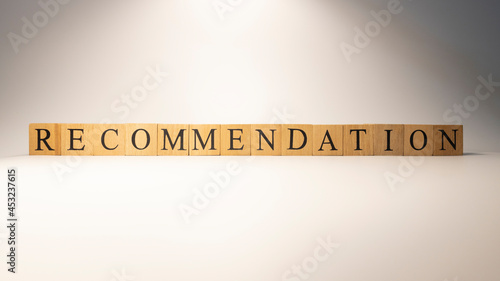 The word recommendation was created from wooden cubes. Consumption and shopping.
