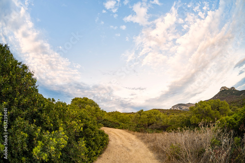 Stunning view a trail leading to Capo Figari. Capo Figari is a limestone promontory located in Gallura, in the north-east of Sardinia, in the municipality of Golfo Aranci, Italy. photo