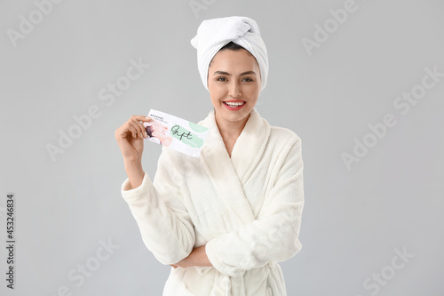 Young woman with gift certi...