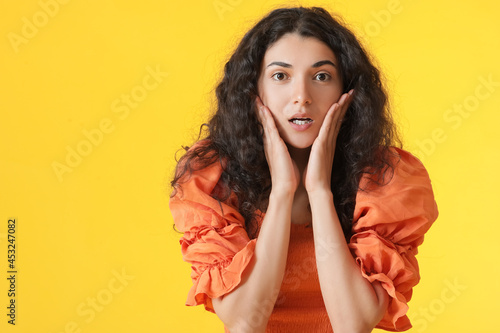 Shocked young woman on colo...